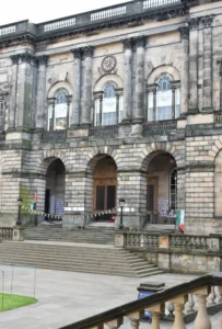Picture of old quad of Edinburgh University with memorial to civilian lives lost in distance