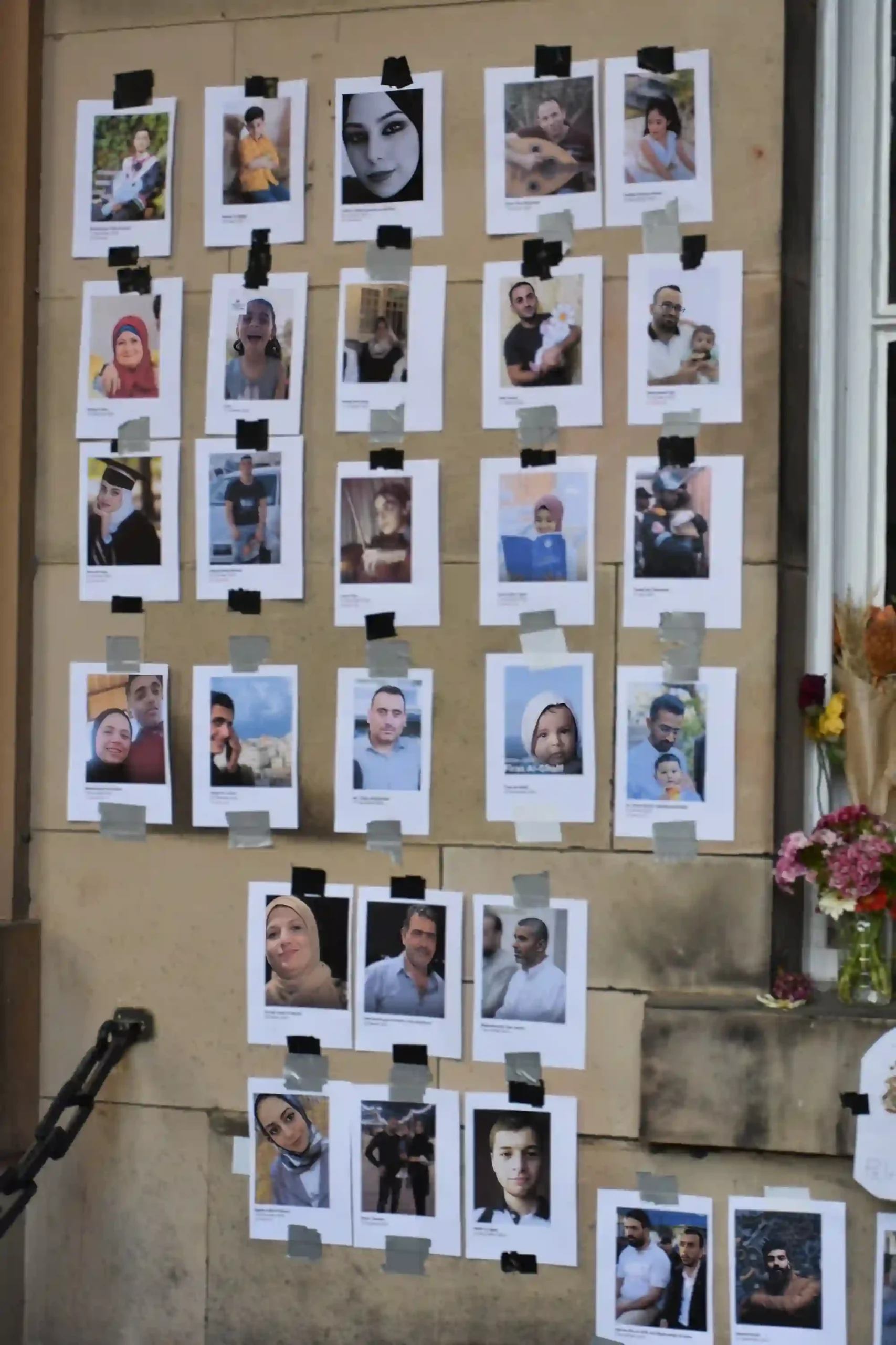 Pictures of people and families killed in Gaza at the University of Edinburgh memorial